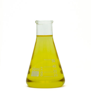 basil essential oil in beaker