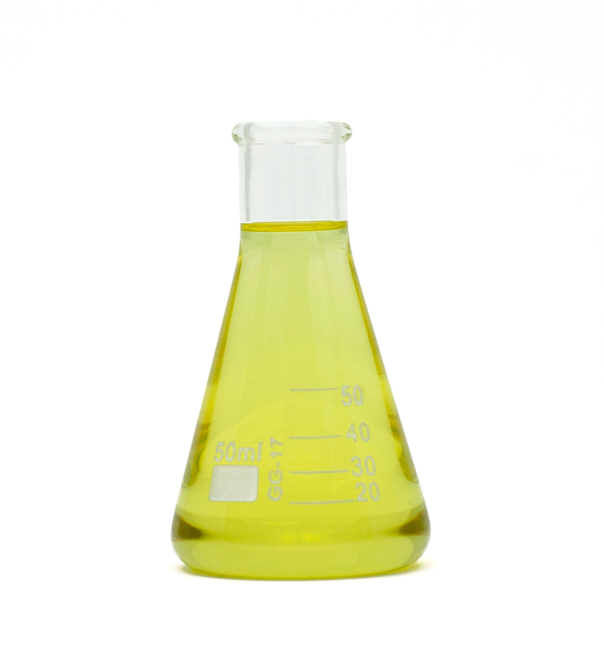 Cedarwood essential oil in beaker