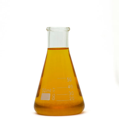 orange essential oil in beaker
